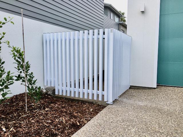 side house front yard fence white metallic picket panels