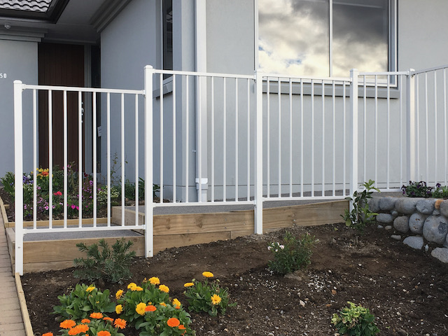 white metal bar fencing panels