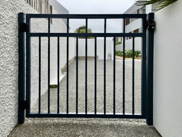 person pedestrian gate black bars with scroll for the home